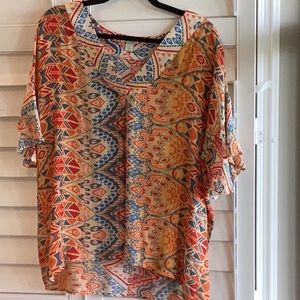 Sundance vibrant flutter sleeve blouse. Fabric is 💯 % viscose, machine washer